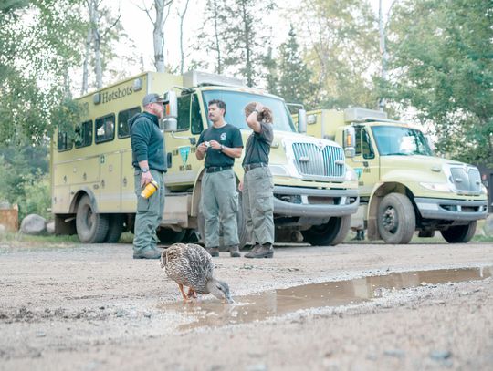 Elite firefighting teams prepare Lodge of Whispering Pines and Big Lake Wilderness Lodge for fire protection