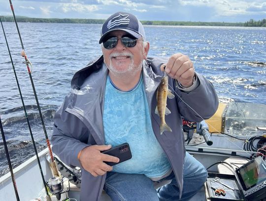 Master angler Mike Banovetz of Ely catches another eight incher while fishing on