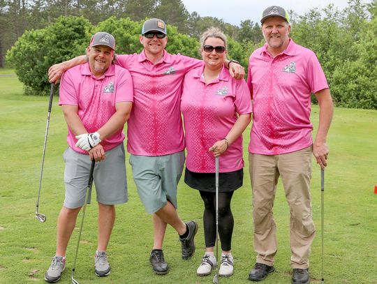 Stopping for a photo op at the par 3 tournament were teammates Joe Koivisto