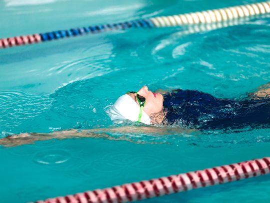 Swimmers in old school pool