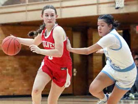 TAKING IT AROUND a defender and to the basket was Ely sophomore Zoe MacKenzie.