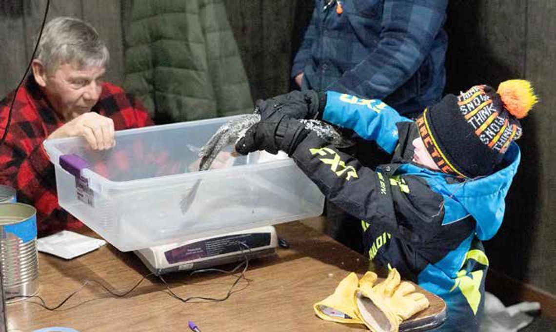 Contestants brave wind during annual Rod & Gun Club ice fishing contest