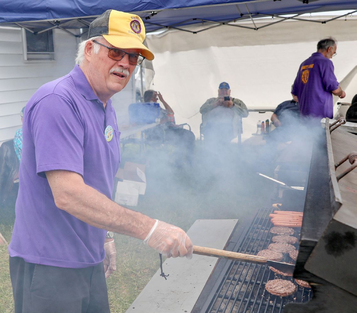 Flipping burgers for the Babbitt Lions Club was