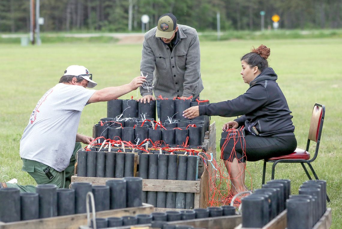 Helping set up for the fireworks were Morse-Fall Lake firefighters Chris Schlosser