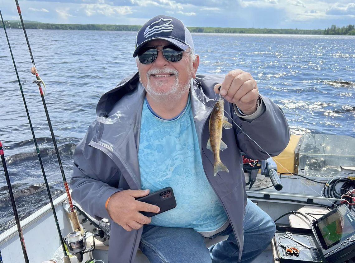 Master angler Mike Banovetz of Ely catches another eight incher while fishing on