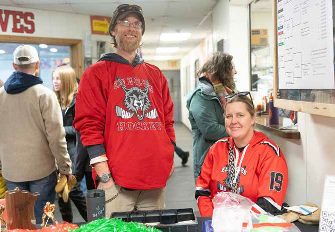 Matt Fetterer and Nicolette Cook sell tickets at the entrance of the Ely Ice Arena during last weekend’s hockey tournament.