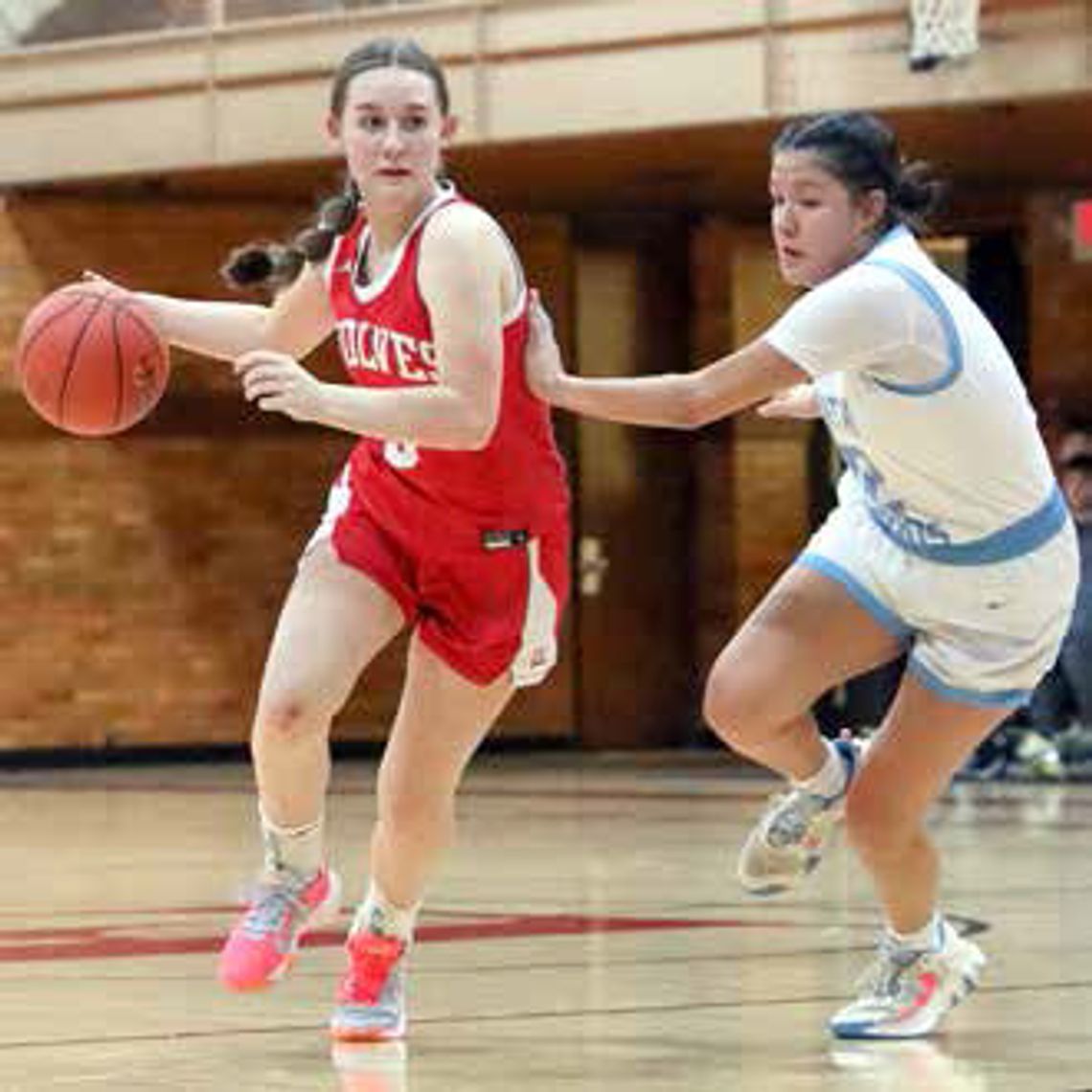 TAKING IT AROUND a defender and to the basket was Ely sophomore Zoe MacKenzie.